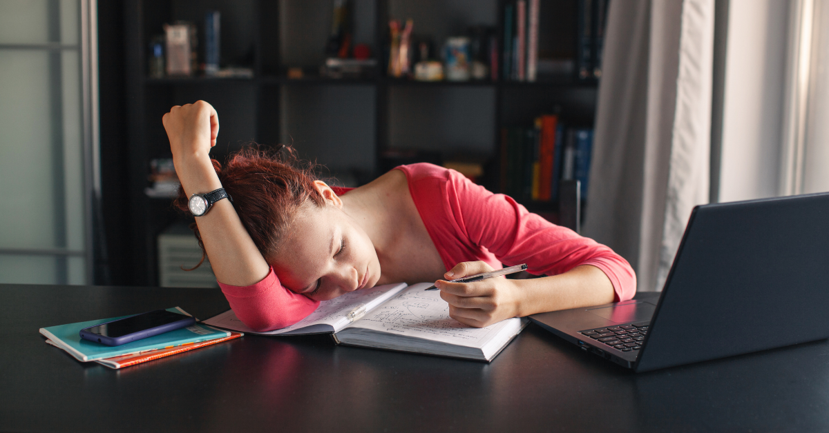 sad student with notebook and laptop