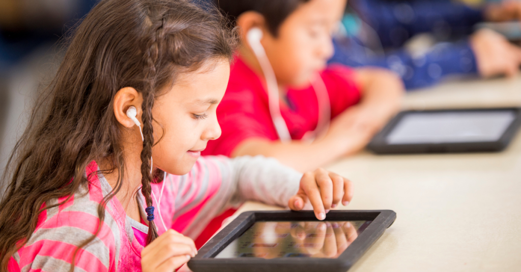 young student on school tablet device